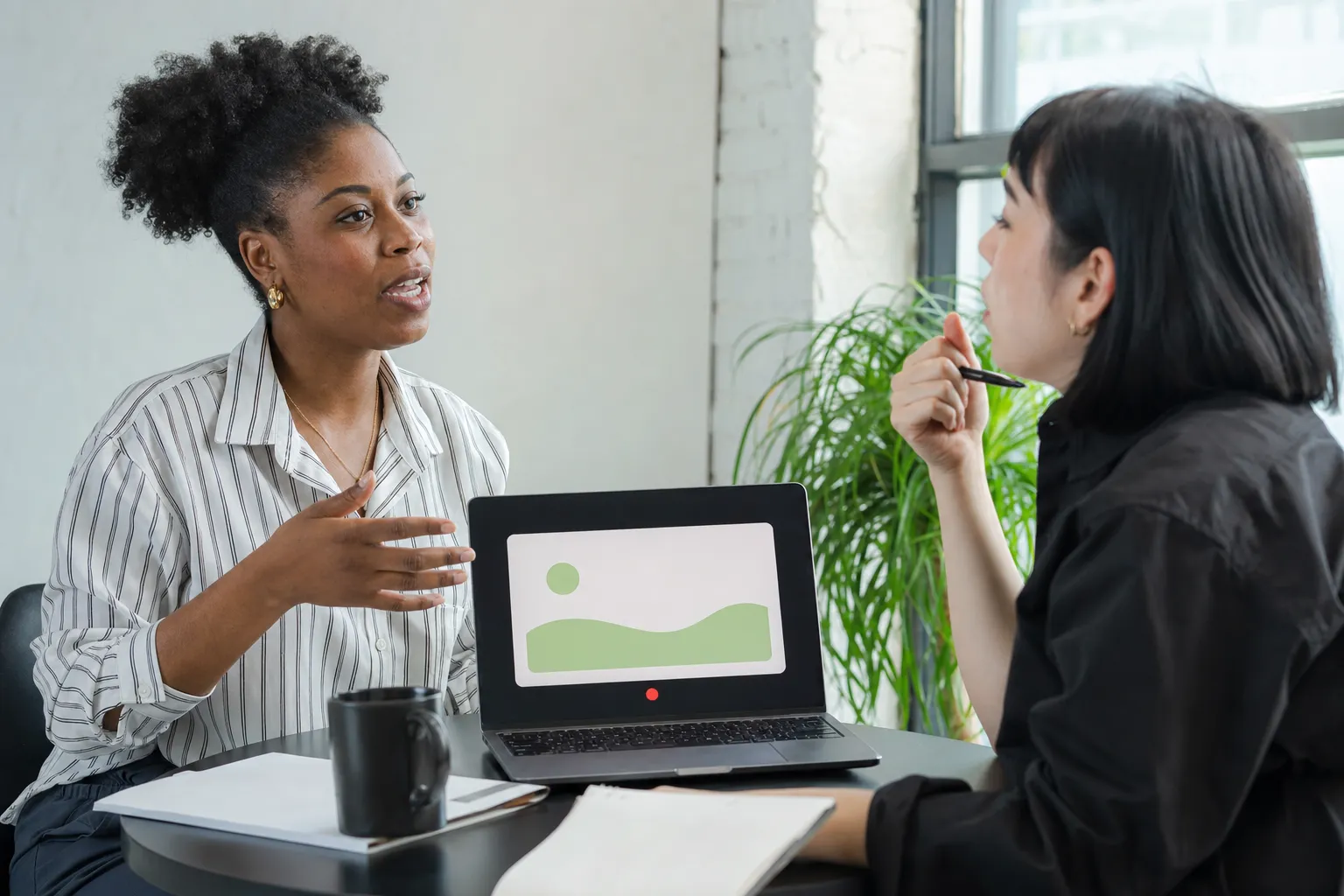A career coach helps a client rehearse an interview while an AI coach displays the next practice question.